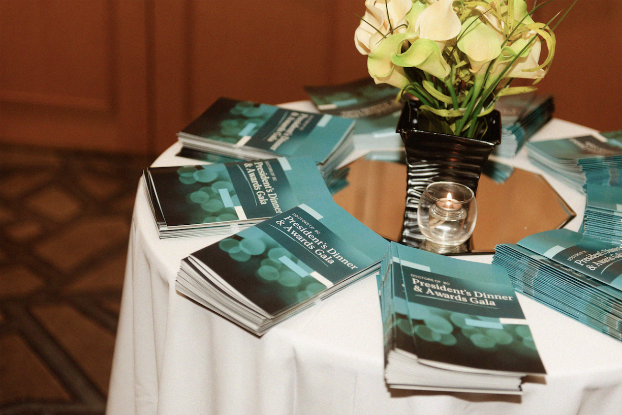 Awards gala booklets on a table.