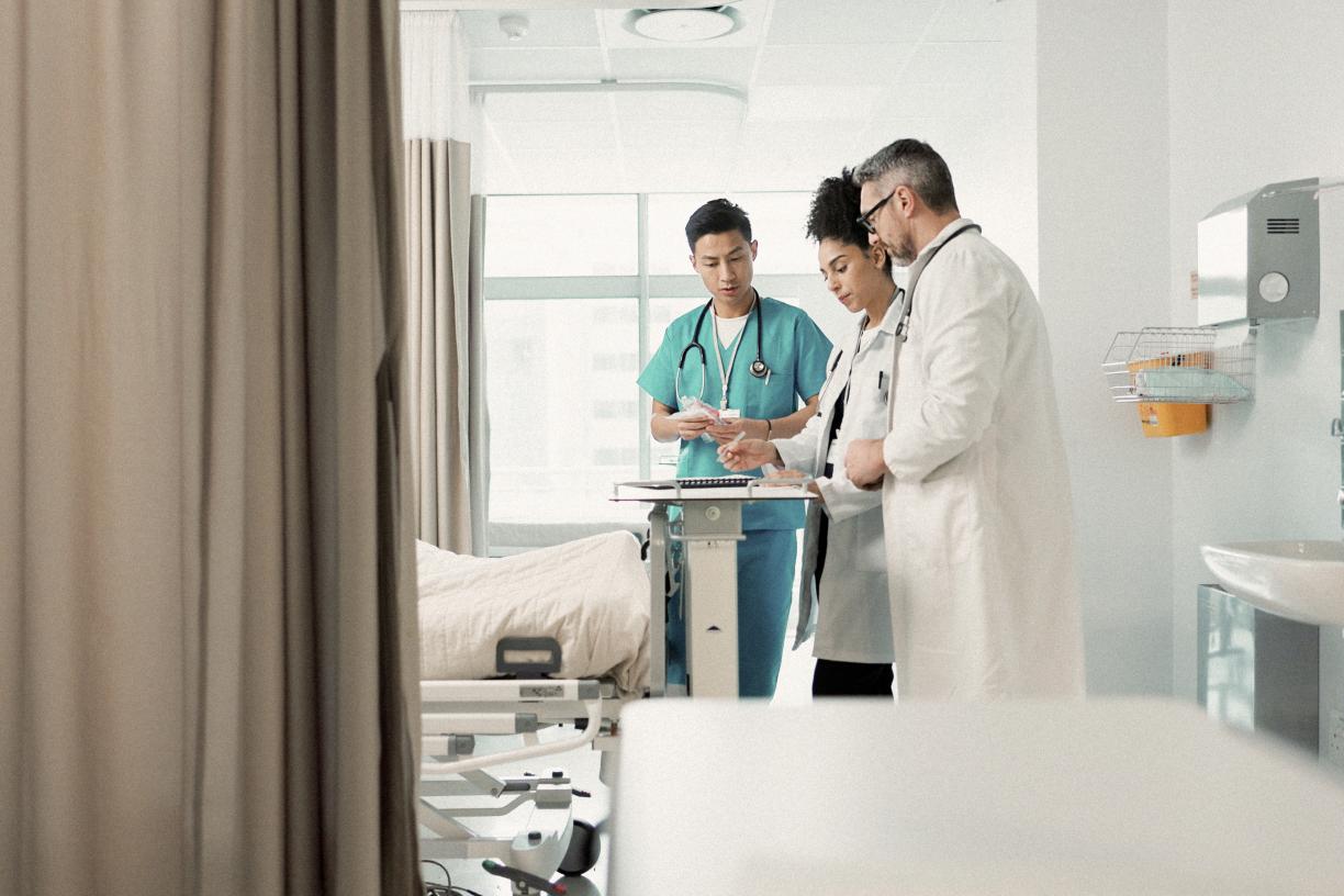 Doctors in hospital room.