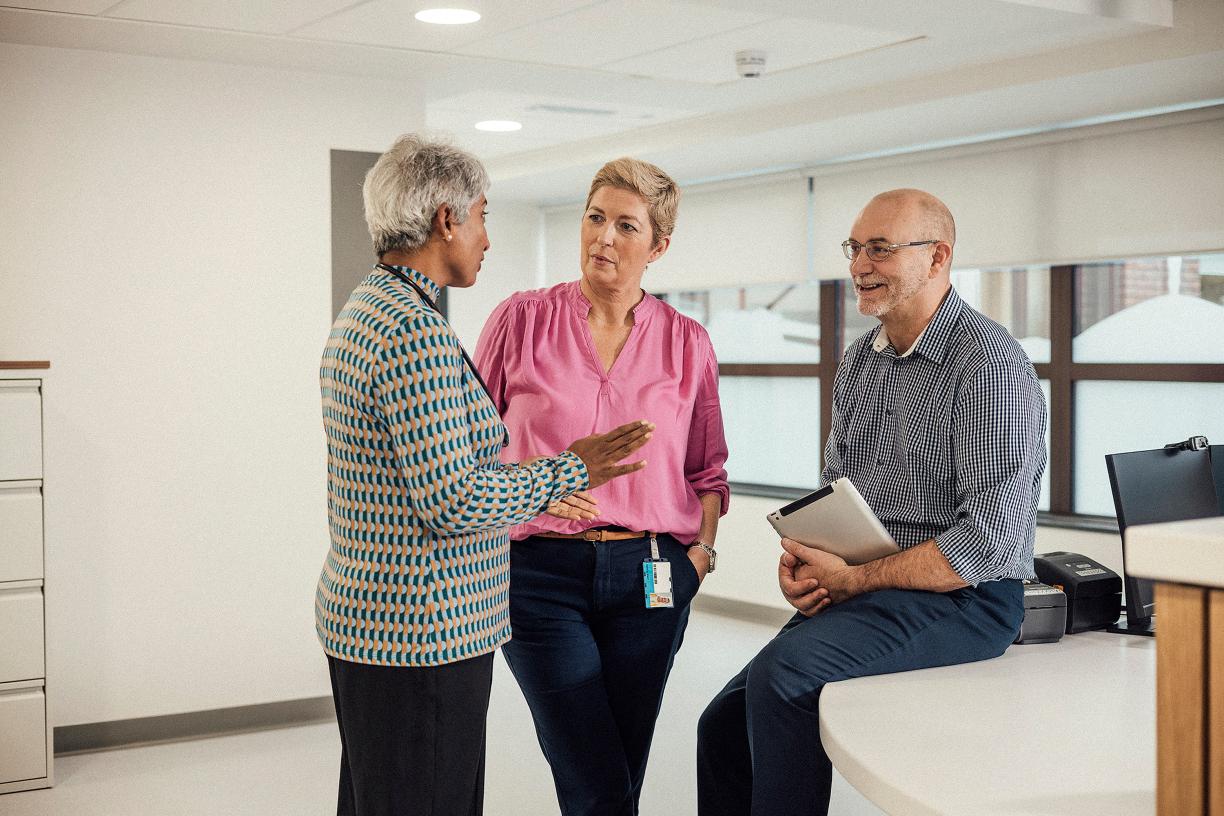 Healthcare professionals talking in office.