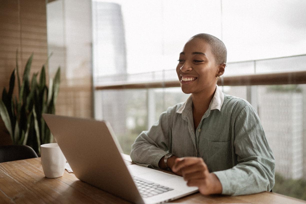 Woman smiling at laptop