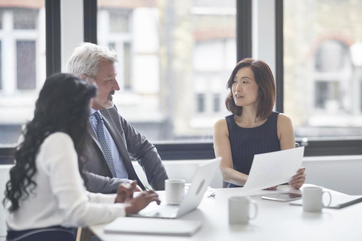 three_people_discussing_business_committee_istock_id_303845.jpg