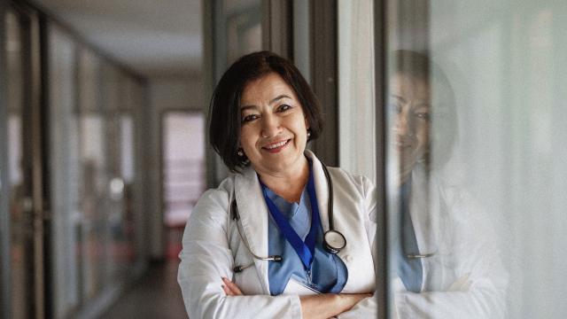 Doctor looking into the camera smiling. 