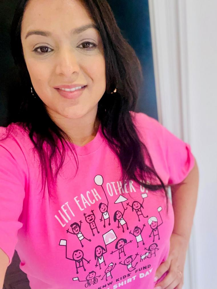 Dr%20Dosanjh%20wearing%20a%20pink%20shirt%20