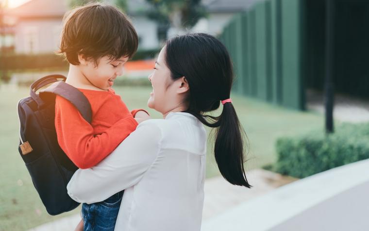 Mom%20holding%20son%20with%20backpack Mom%20holding%20son%20with%20backpack