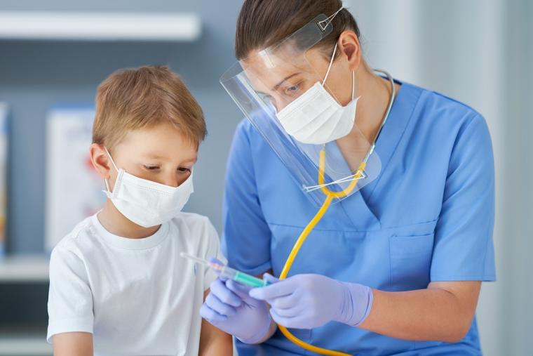 Child%20receiving%20COVID-19%20vaccine%20form%20physician%20
