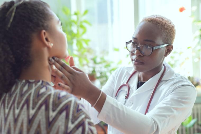 Woman%20physician%20examining%20patient%20
