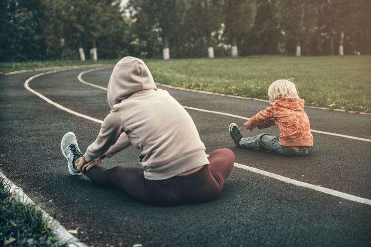 Mother exercising with her child