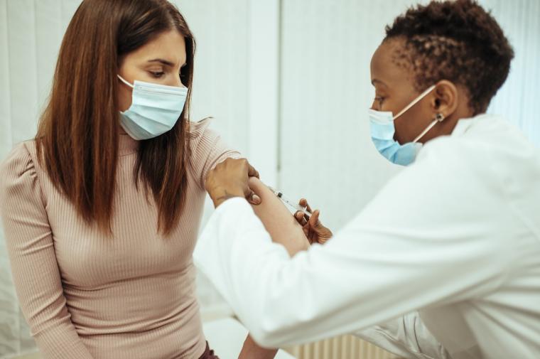 Young%20woman%20getting%20COVID-19%20vaccine