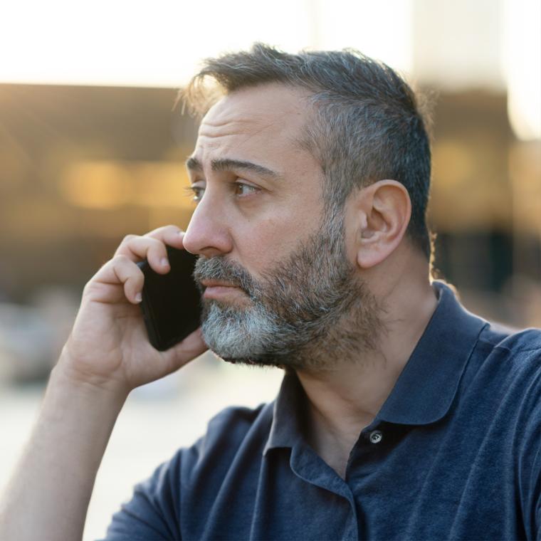 Concerned man on phone